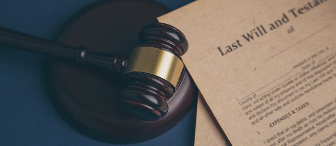 Last will and testament on yellowish paper with wooden judge gavel, Probate Administrative